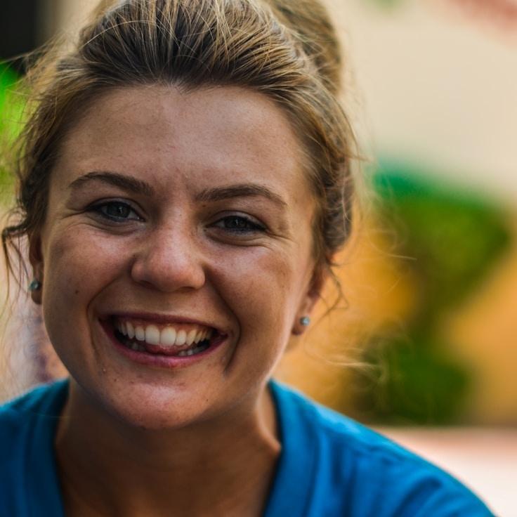 Alex Reed, Lead Design Curator at Cedar Whisper Quartz, reviewing corporate floral arrangements